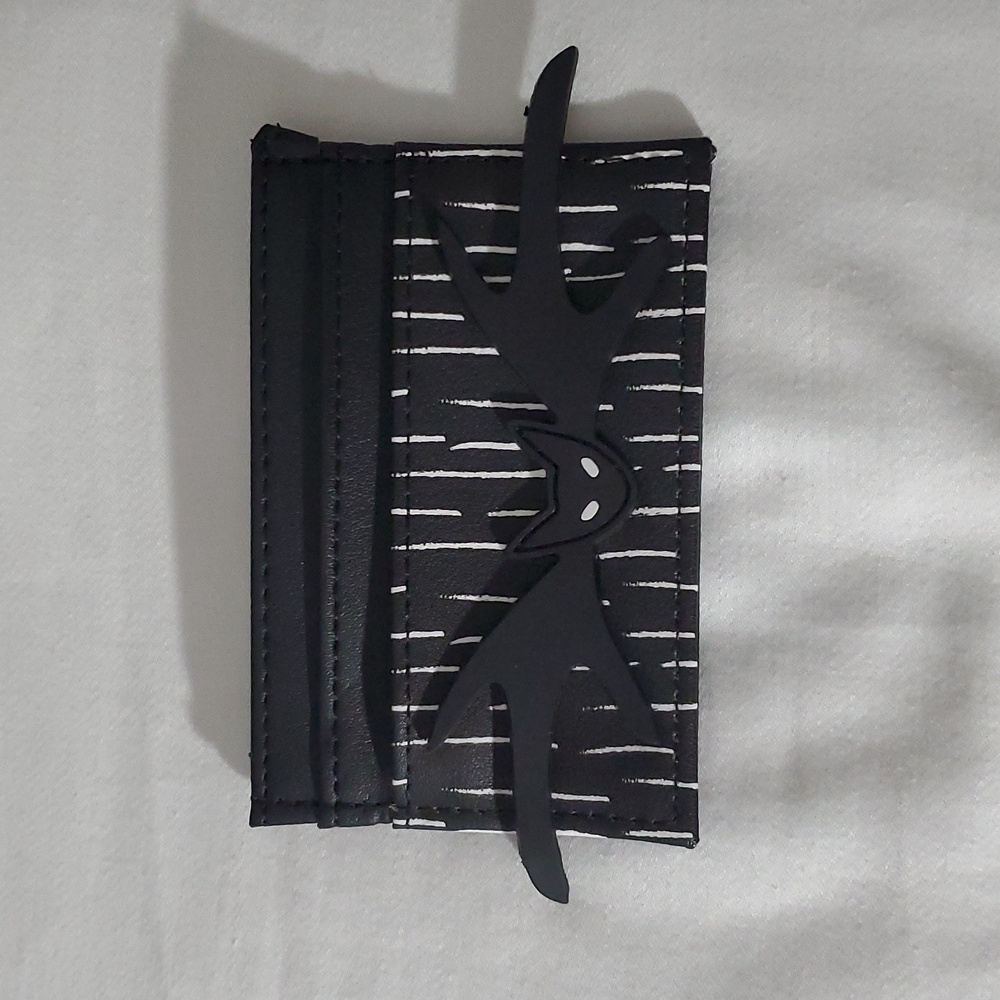 This item is a Nightmare Before Christmas Jack Skellington-themed card holder. I